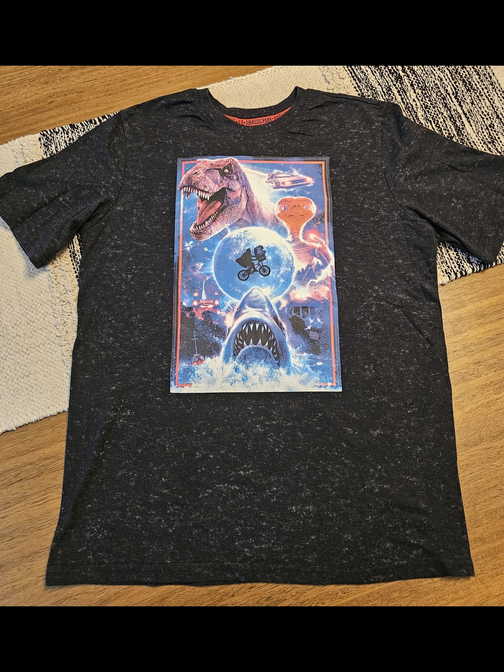 Universal Black 'Welcome to Extraordinary' Graphic Tee